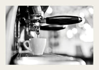 Black and white photo of espresso machine with cup during brewing-3