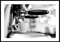 Black and white photo of espresso machine with cup during brewing-0