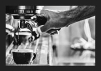 Black and white photo of hand brewing espresso in cup-5