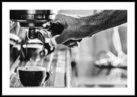Black and white photo of hand brewing espresso in cup-0