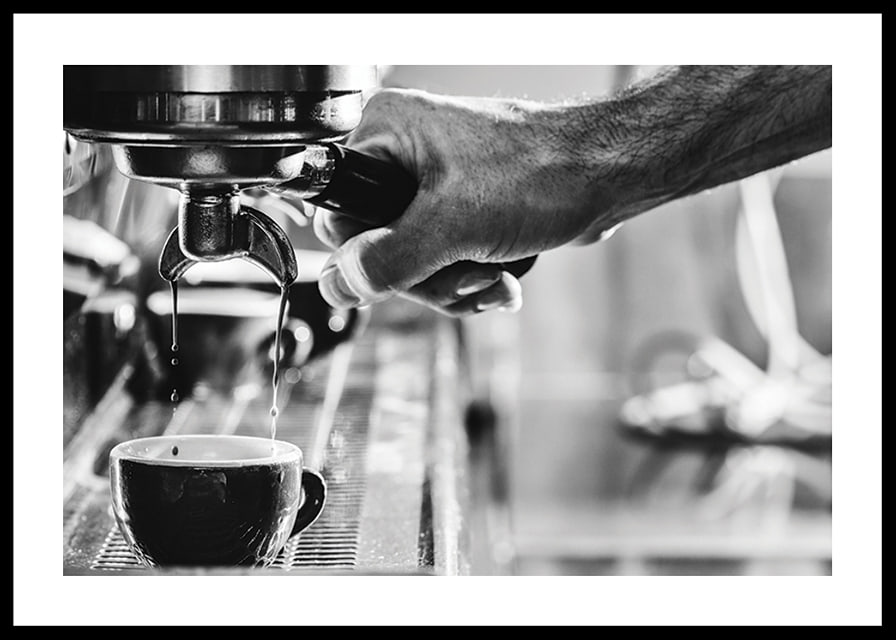 Black and white photo of hand brewing espresso in cup-12