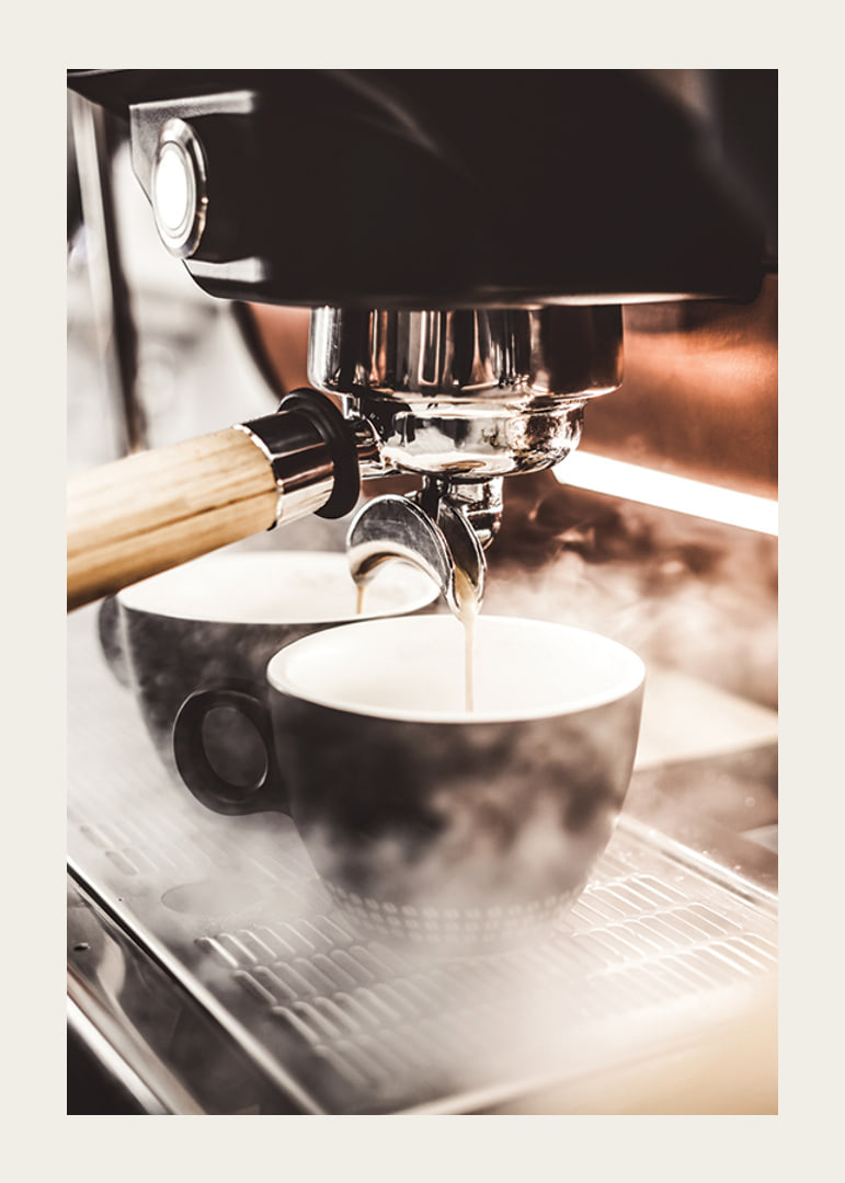 Close-up of espresso machine brewing coffee in dark cups-12