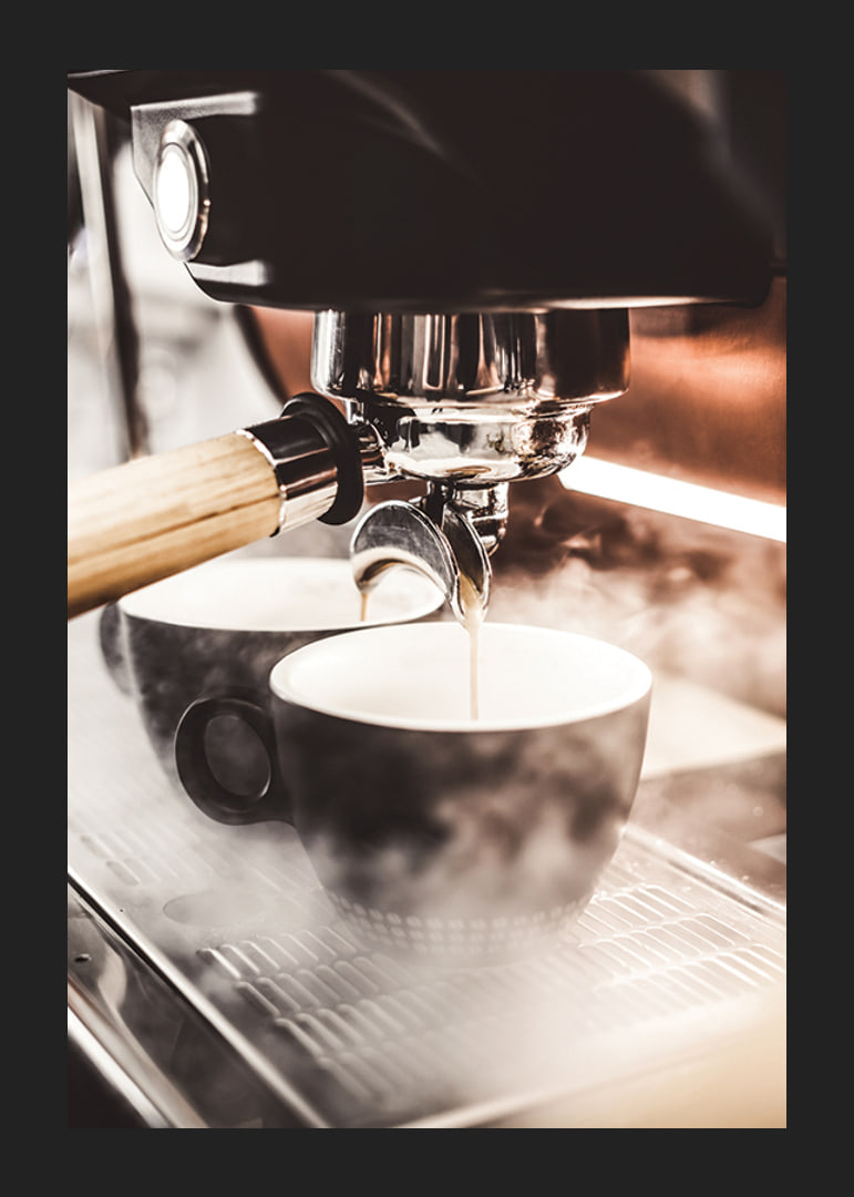 Close-up of espresso machine brewing coffee in dark cups-12