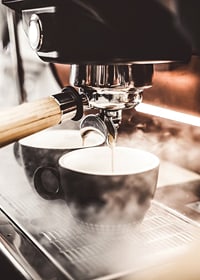 Close-up of espresso machine brewing coffee in dark cups-7