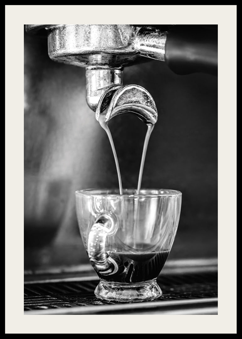 Black and white photo of espresso machine brewing coffee in cup-12