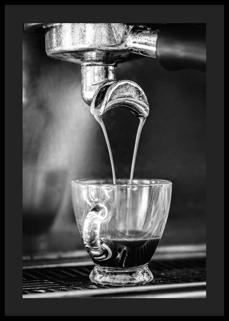Black and white photo of espresso machine brewing coffee in cup-12