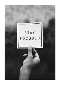 Black and white photo of hand holding note with text-1