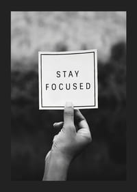 Black and white photo of hand holding note with text-5