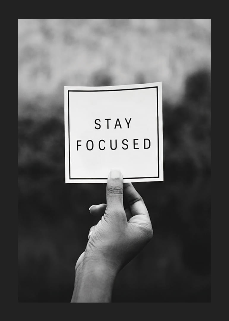 Black and white photo of hand holding note with text-12