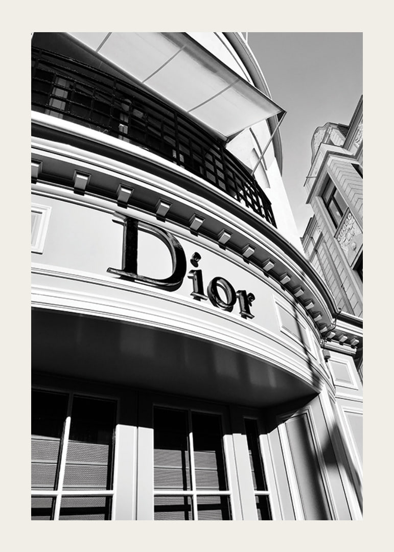 Black and white close-up of Dior store facade with graphic lines-12