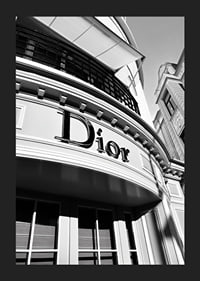 Black and white close-up of Dior store facade with graphic lines-5