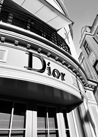 Black and white close-up of Dior store facade with graphic lines-7