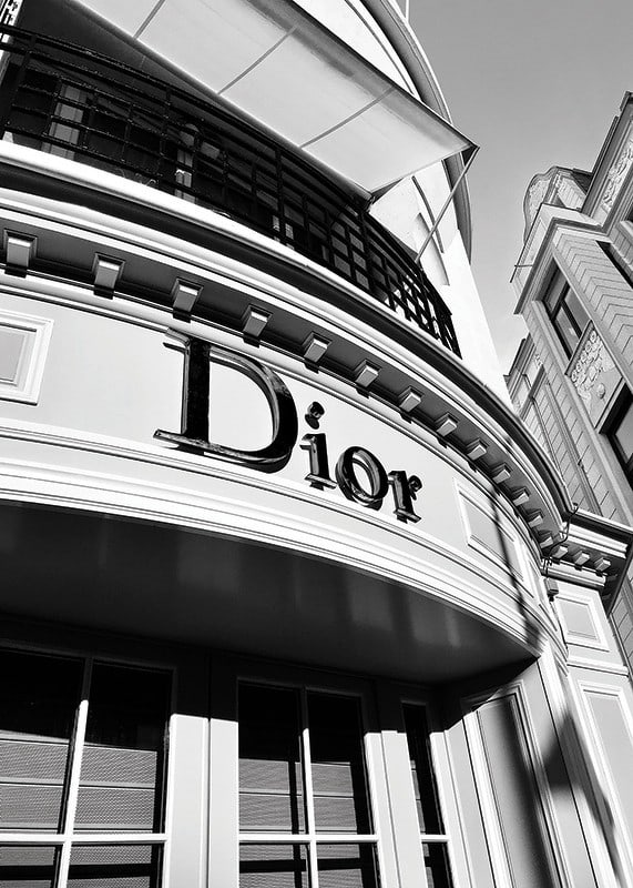 Black and white close-up of Dior store facade with graphic lines-12