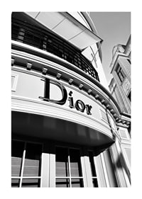 Black and white close-up of Dior store facade with graphic lines-1