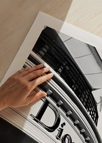 Black and white close-up of Dior store facade with graphic lines-9