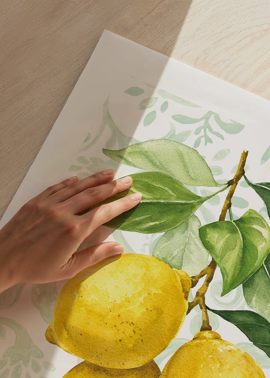 Watercolor of three lemons with green leaves against a patterned background-12