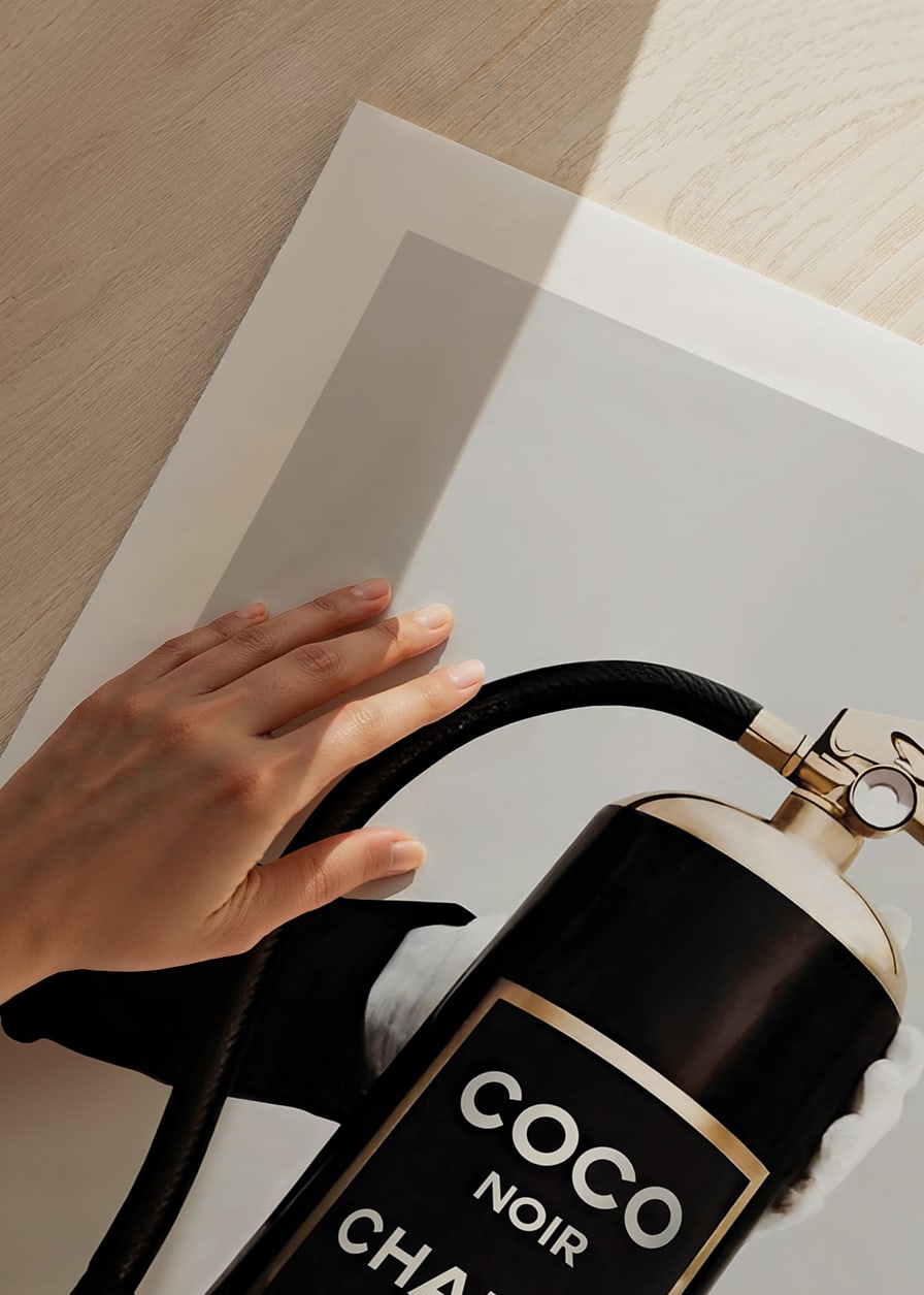 Stylized fire extinguisher in black and gold with Chanel label-12