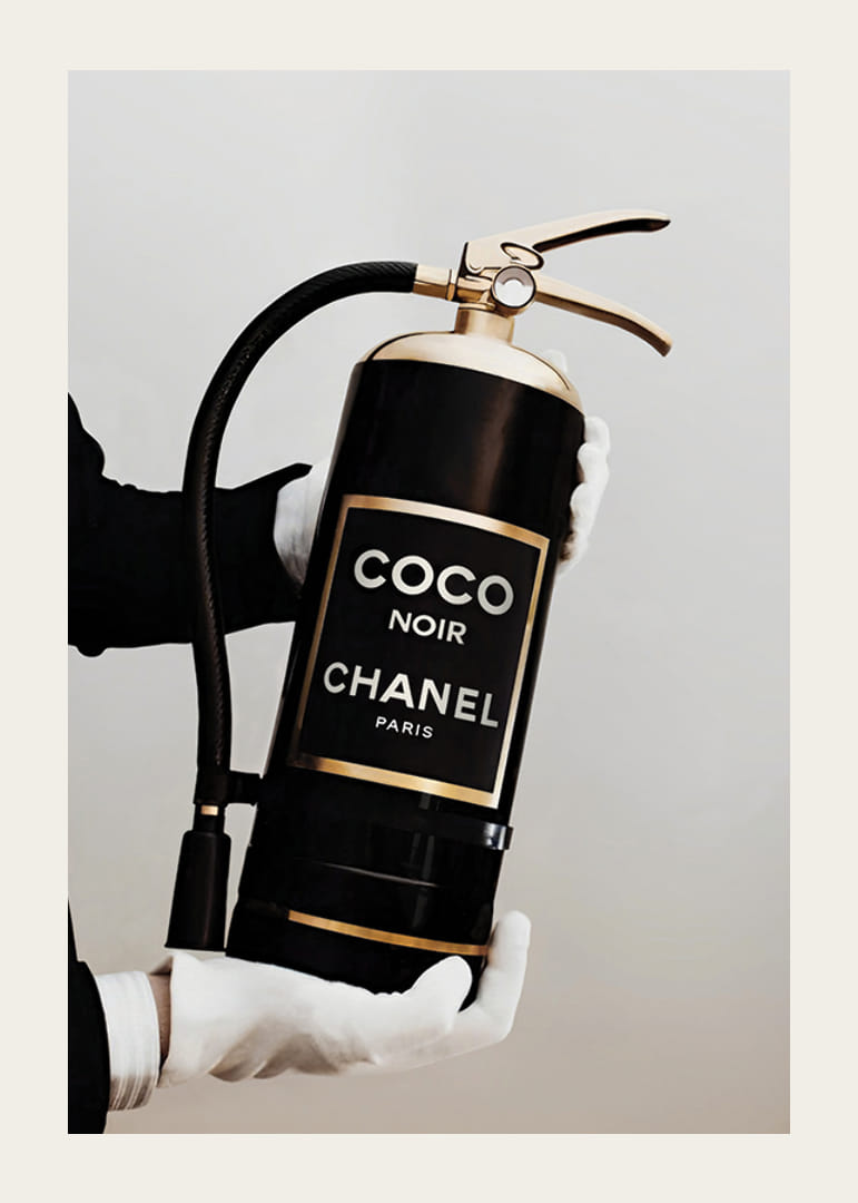 Stylized fire extinguisher in black and gold with Chanel label-12