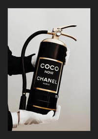 Stylized fire extinguisher in black and gold with Chanel label-5