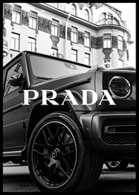 Black and white close-up of Mercedes G-Class in front of building with Prada text-6