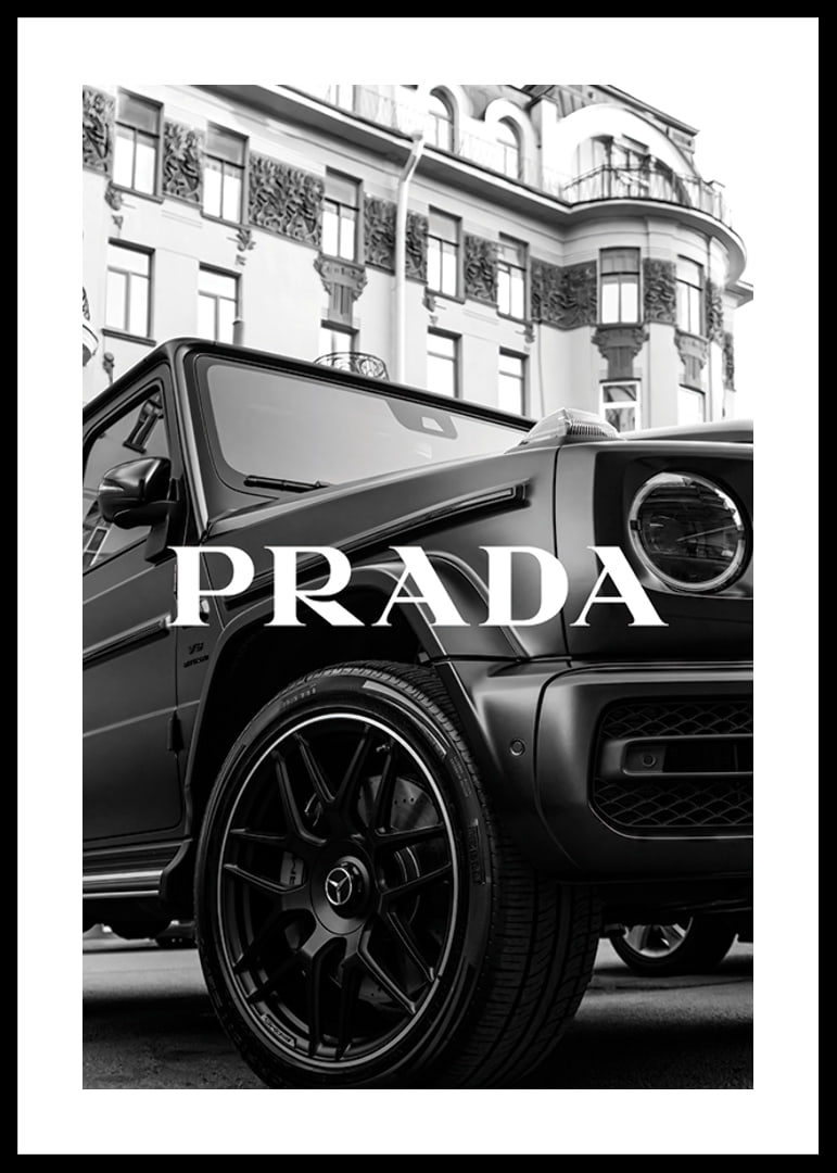 Black and white close-up of Mercedes G-Class in front of building with Prada text-12