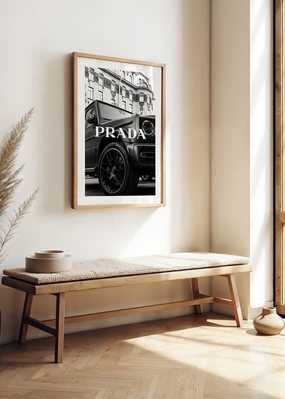 Black and white close-up of Mercedes G-Class in front of building with Prada text-12