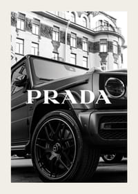 Black and white close-up of Mercedes G-Class in front of building with Prada text-3