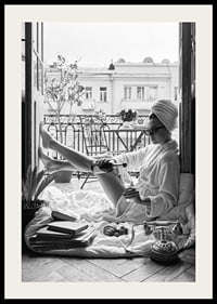 Black and white photo of woman in bathrobe on balcony-2