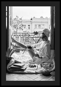 Black and white photo of woman in bathrobe on balcony-4