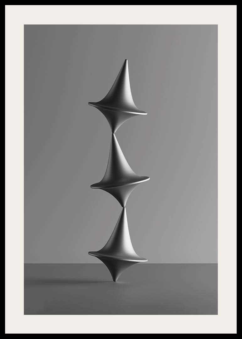 Čiernobiela fotografia troch naukladaných káčov na sivom pozadí-12