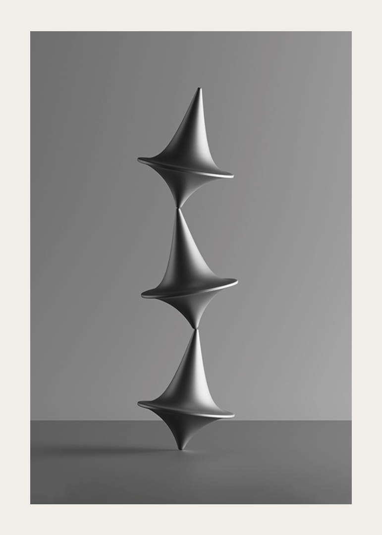 Čiernobiela fotografia troch naukladaných káčov na sivom pozadí-12