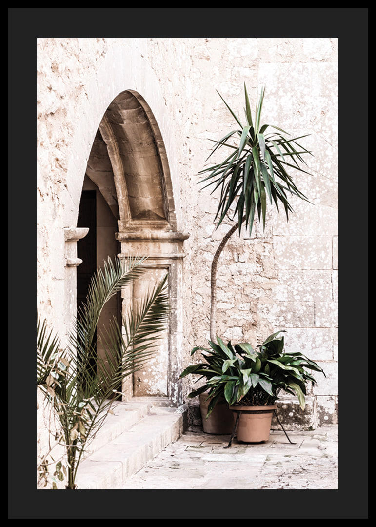 Photograph of stone arches and potted plants in a bright Mediterranean setting-12