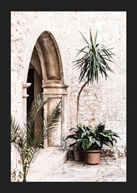 Photograph of stone arches and potted plants in a bright Mediterranean setting-5