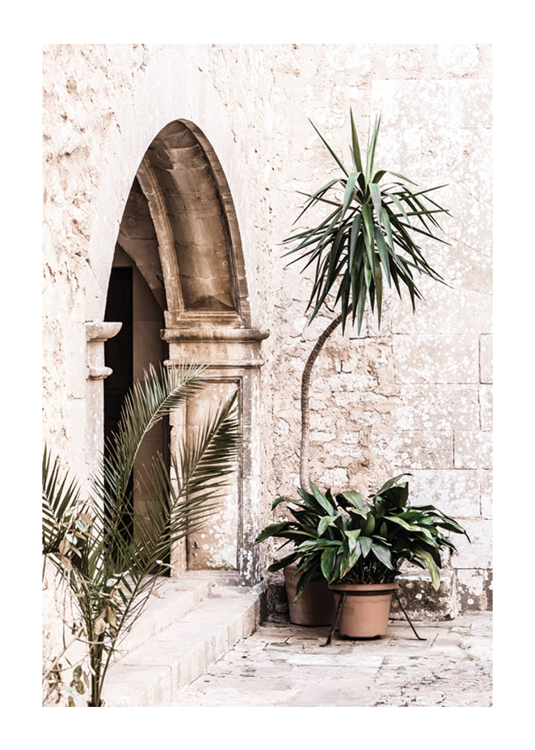 Photograph of stone arches and potted plants in a bright Mediterranean setting-12