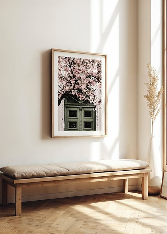 Fotografi av grön dörr med rosa körsbärsblommor ovanför-12
