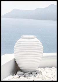 Photograph of white ceramic vase against sea and mountains on Santorini-6