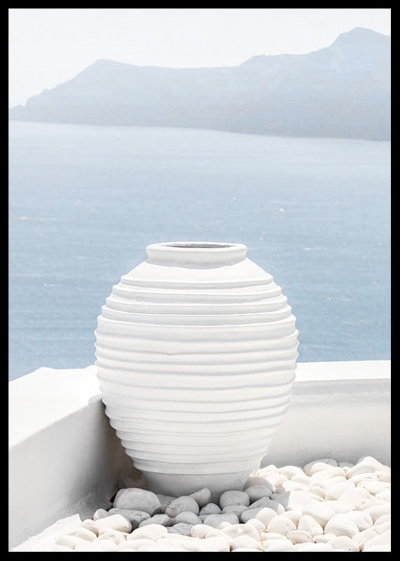 Photograph of white ceramic vase against sea and mountains on Santorini-12