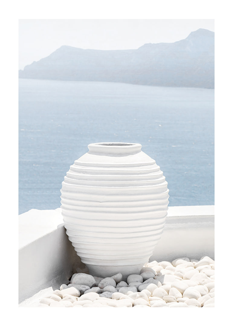 Photograph of white ceramic vase against sea and mountains on Santorini-12
