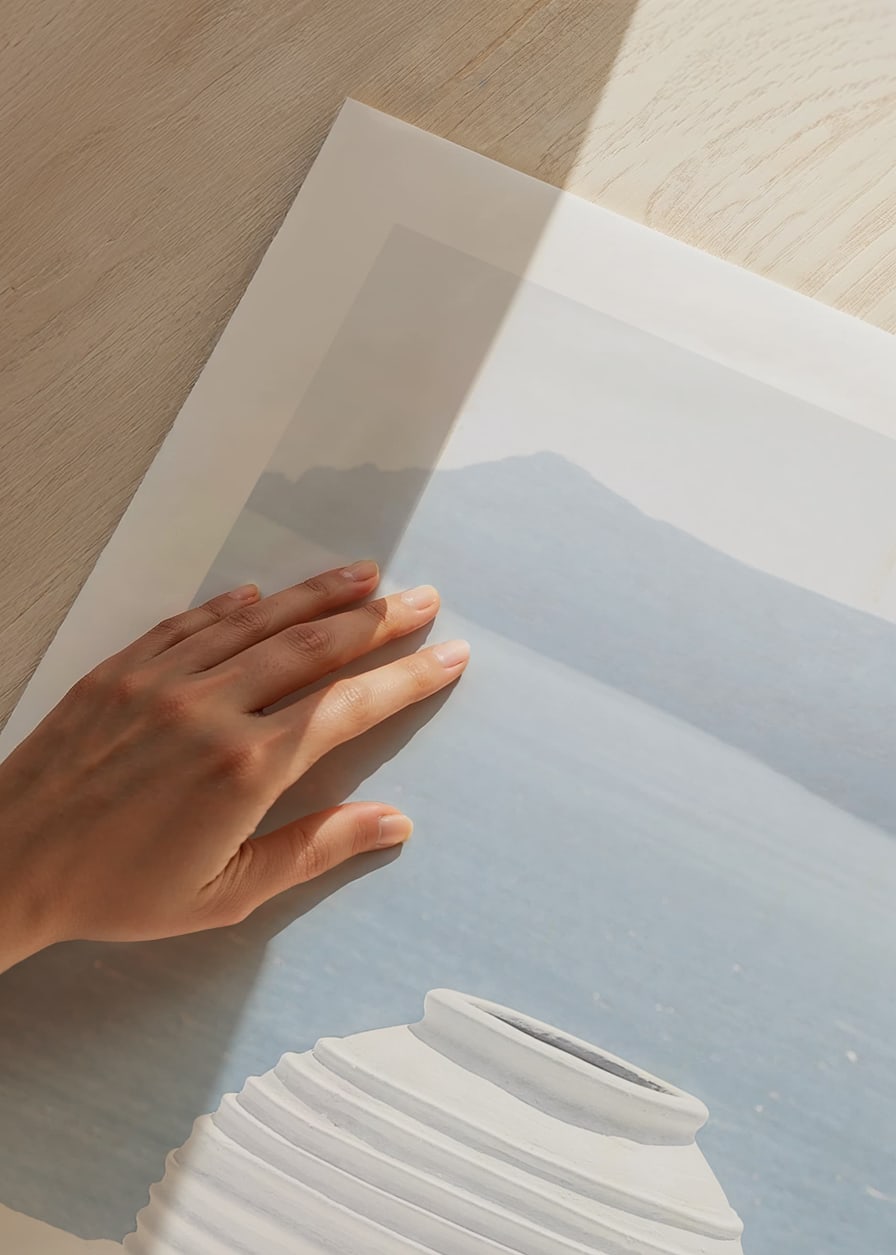 Photograph of white ceramic vase against sea and mountains on Santorini-12