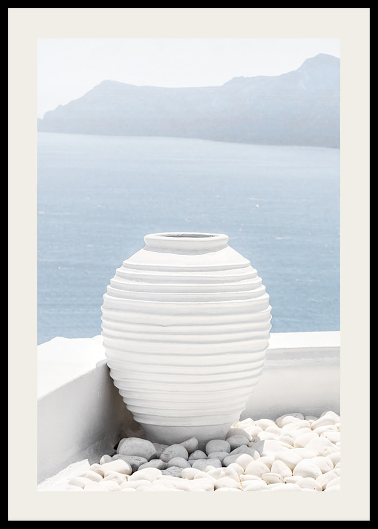 Photograph of white ceramic vase against sea and mountains on Santorini-12