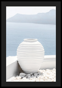 Photograph of white ceramic vase against sea and mountains on Santorini-4