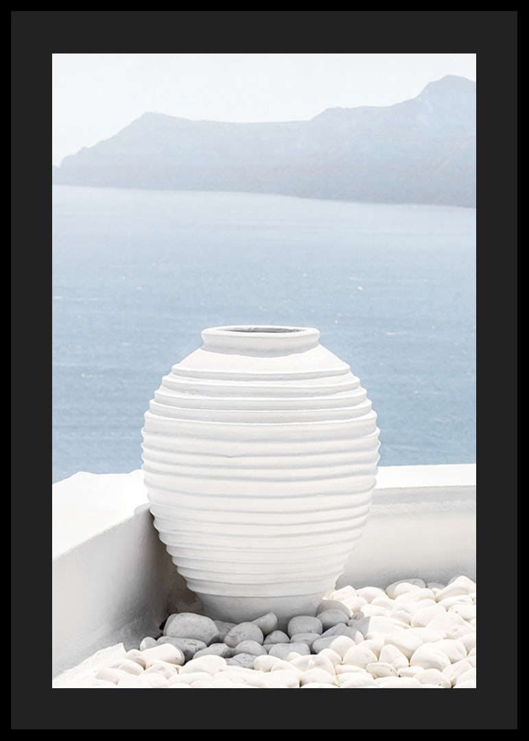 Photograph of white ceramic vase against sea and mountains on Santorini-12