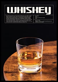 Photograph of whiskey glass on wooden table against black background-0