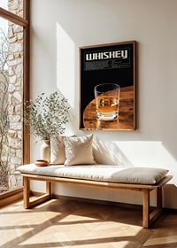 Photograph of whiskey glass on wooden table against black background-2