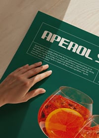 Two Aperol Spritz in wine glasses with orange slices on tray-3