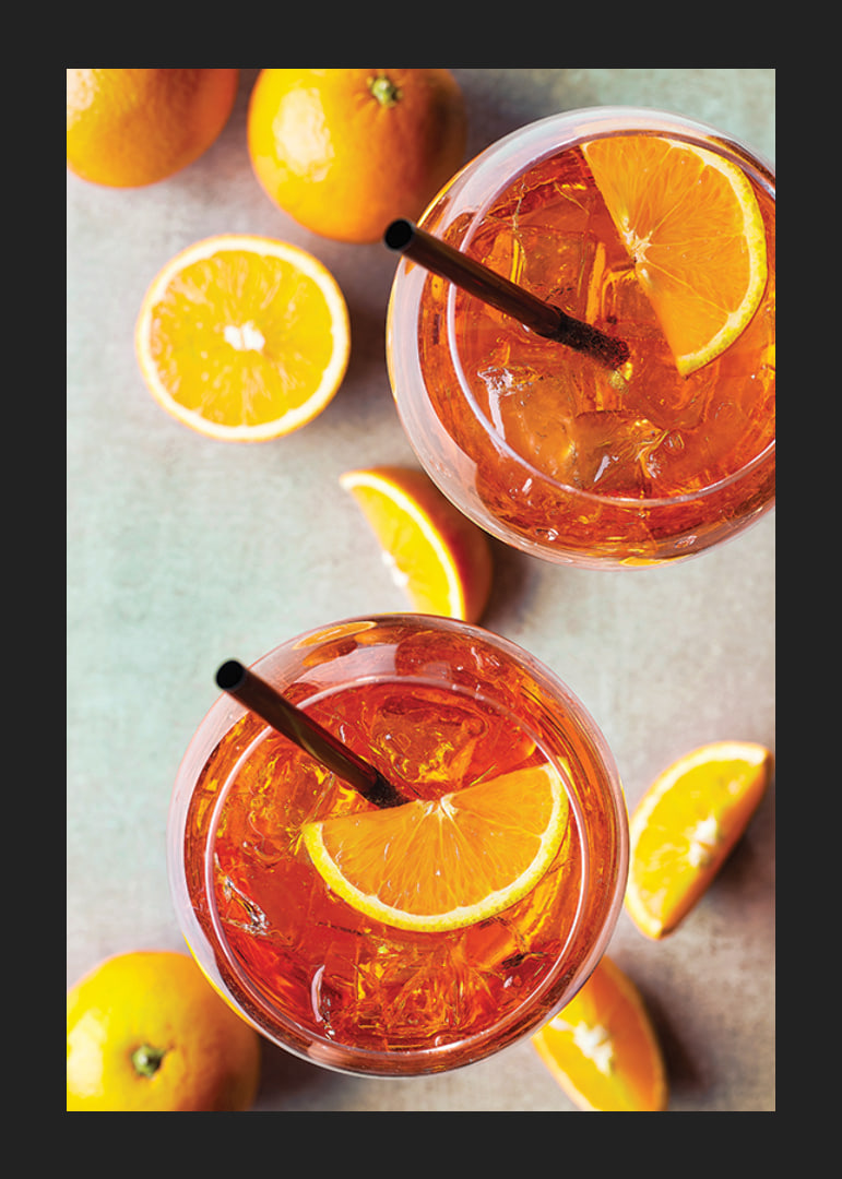 Photograph of two Aperol Spritz with orange slices from above-12