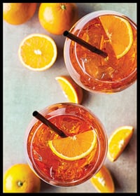 Photograph of two Aperol Spritz with orange slices from above-6