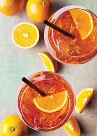 Photograph of two Aperol Spritz with orange slices from above-7