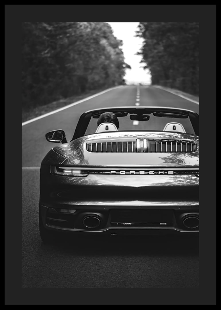 Black and white Porsche 911 convertible rear view on country road-12
