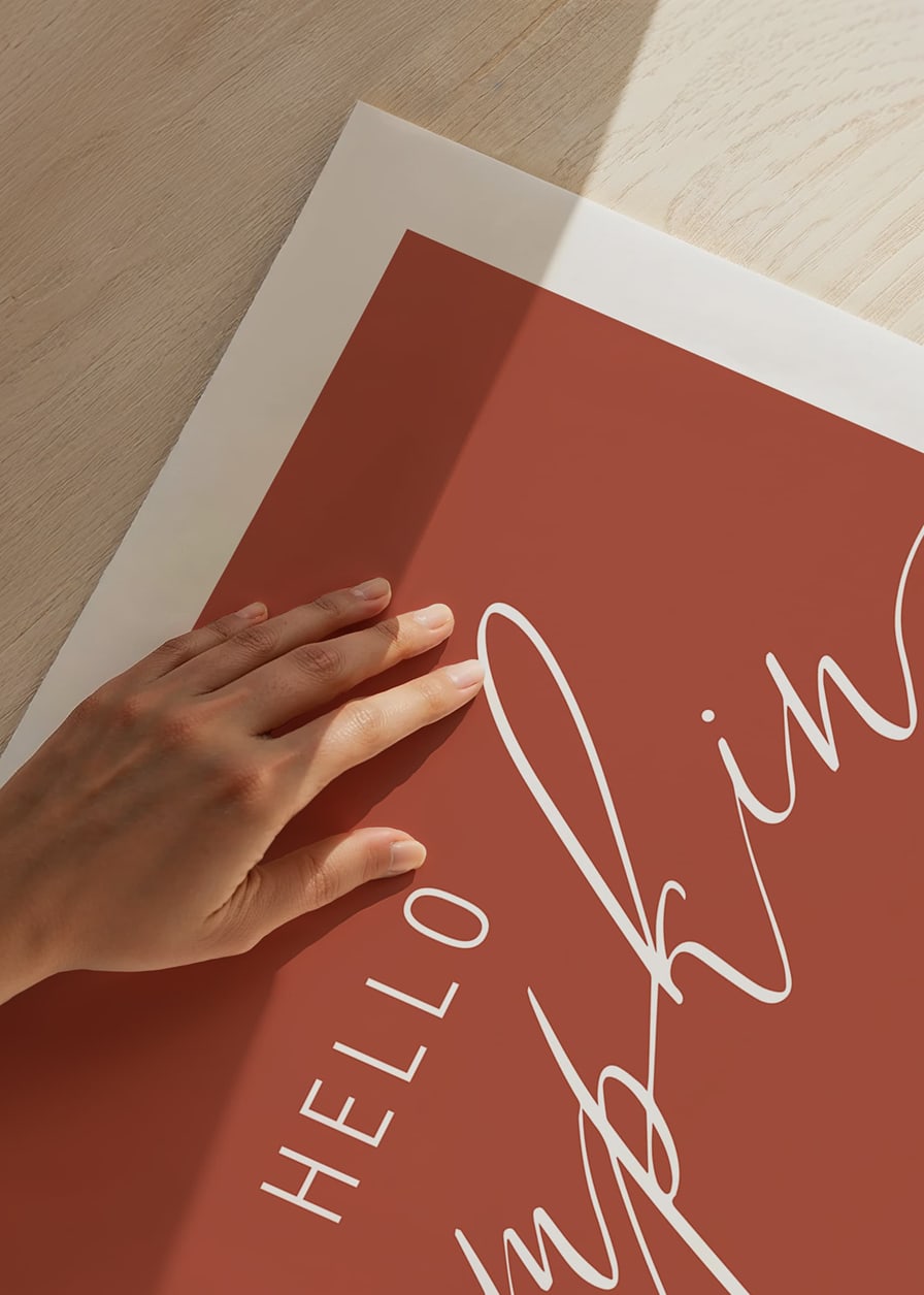 White handwritten text 'Hello Pumpkin' in script style on warm autumn red background-12
